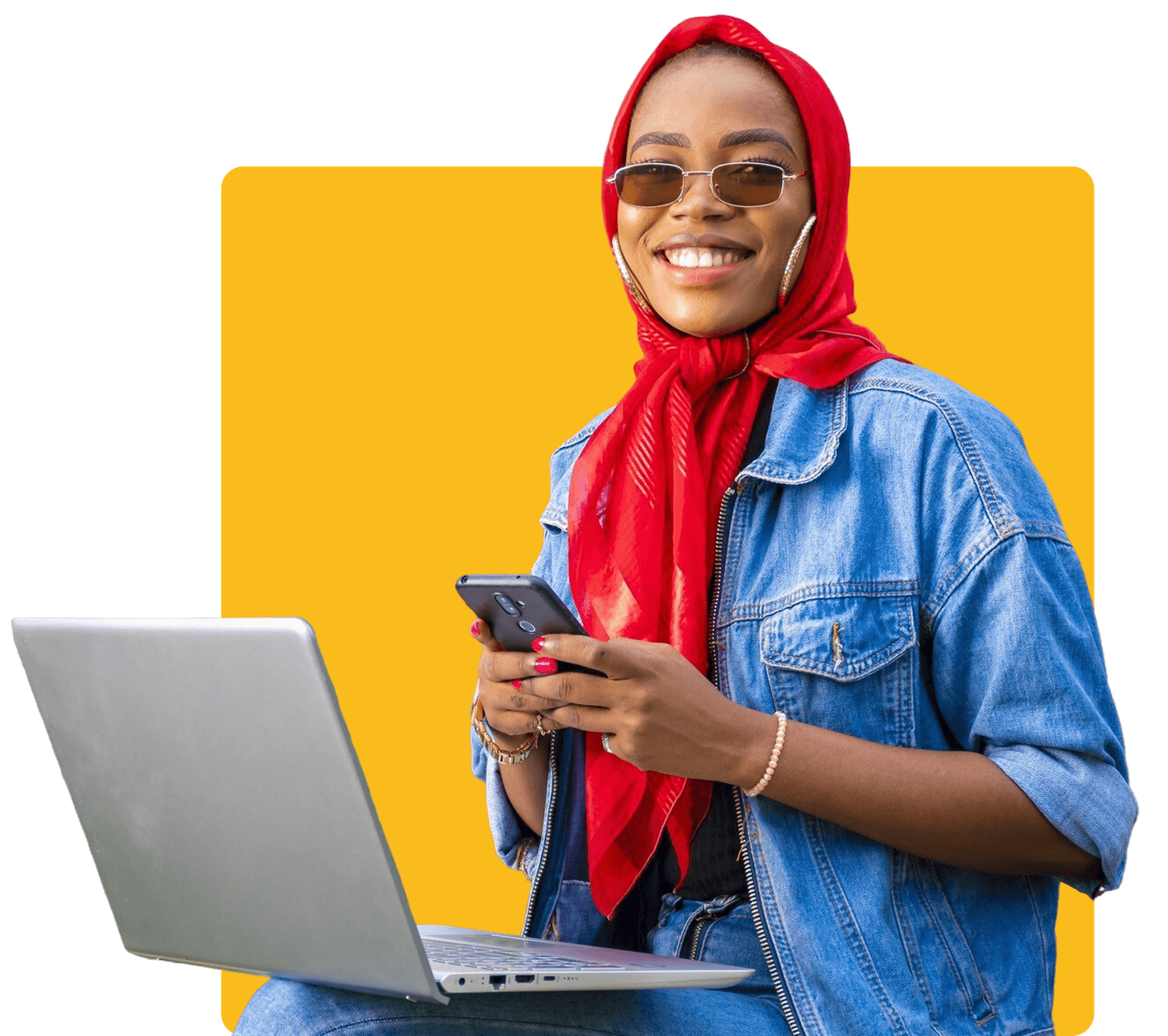 young-woman-sitting-outside-with-her-laptop-phone